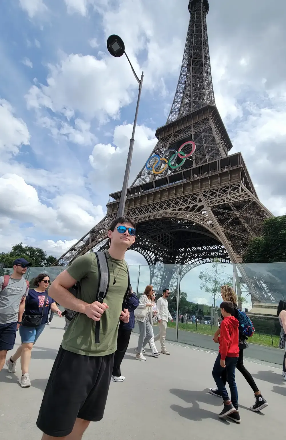 Travis Heavener in front of the Eiffel Tower.